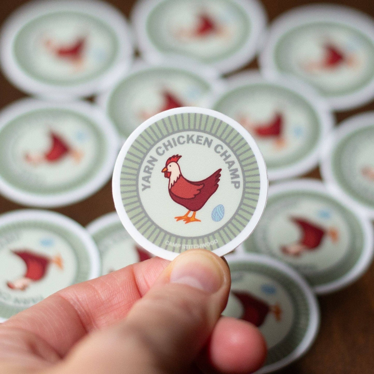 Camp Stitchwood Yarn Chicken Champ name badge sticker with playful chicken design