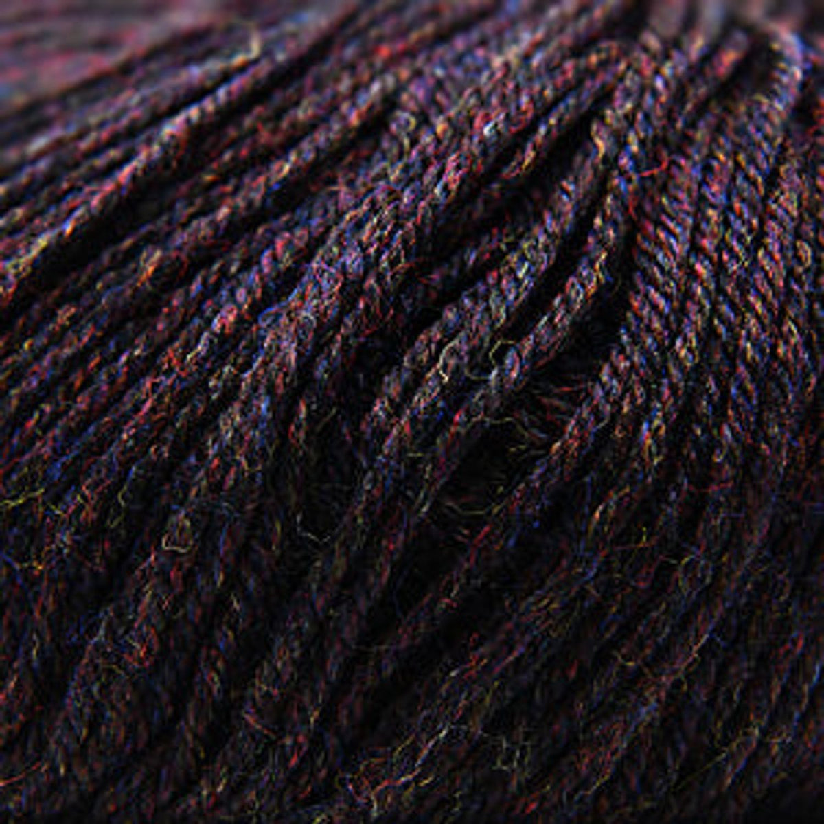 Cascade Yarns 220 Superwash wool in deep dark shades, perfect for versatile knitting projects