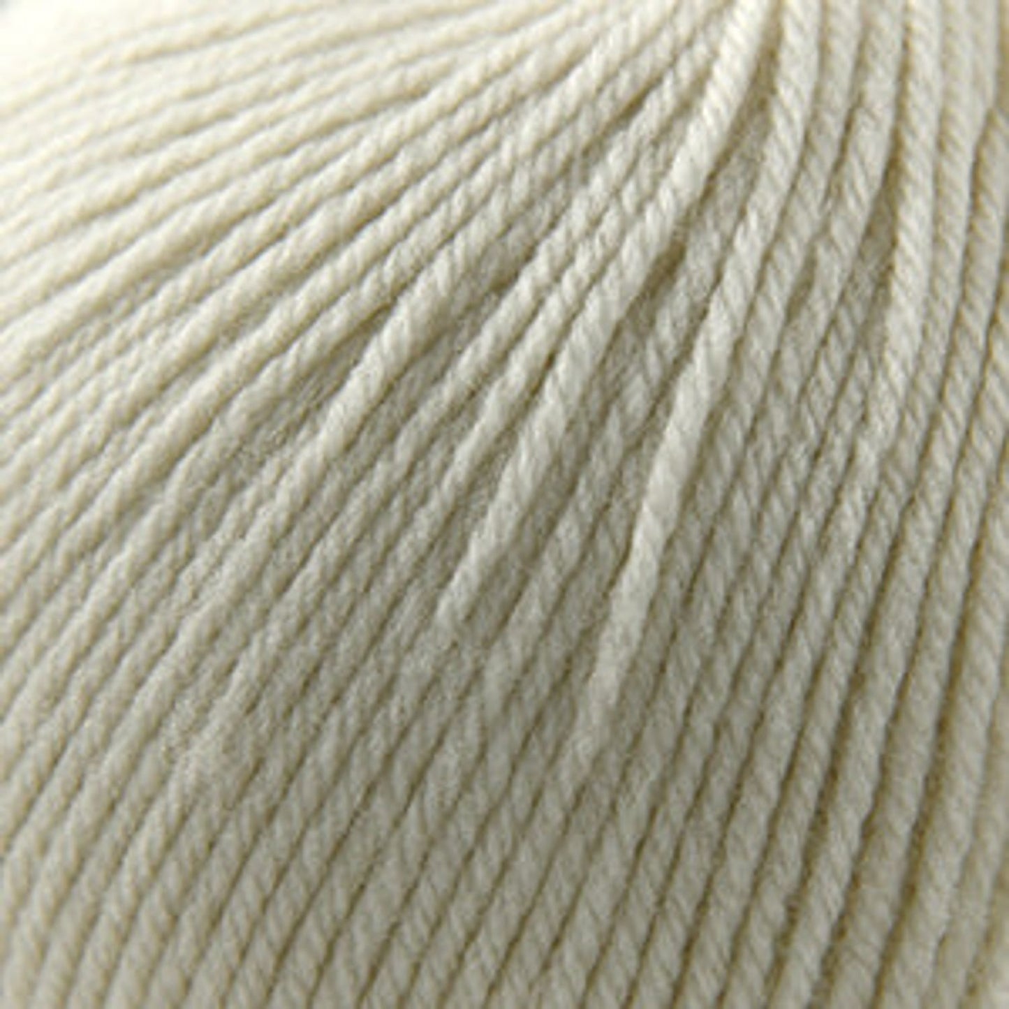 Cream Cascade Yarns 220 Superwash wool yarn in a soft, smooth texture perfect for various projects