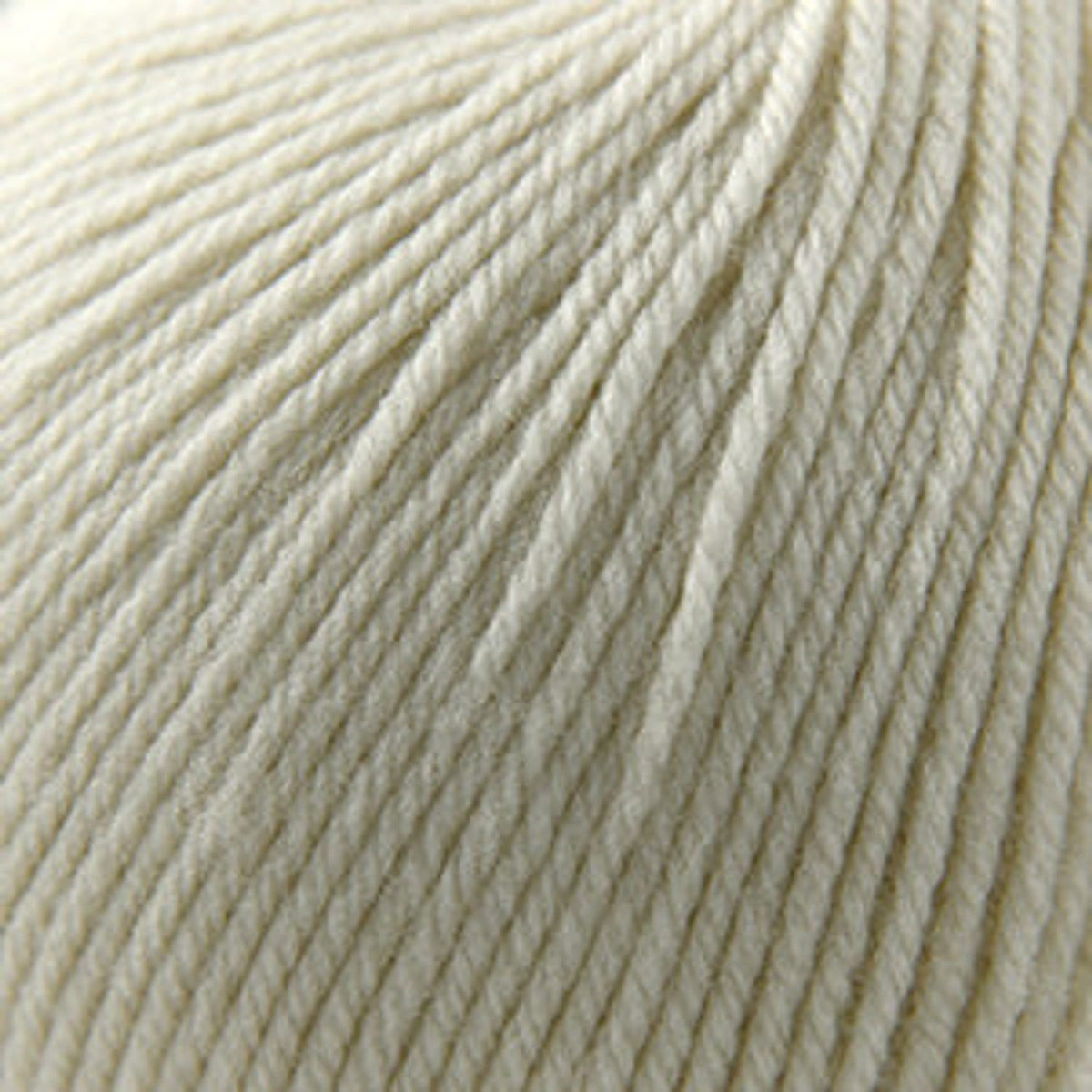 Cascade Yarns 220 Superwash wool in cream color with a smooth texture for knitting and crocheting projects