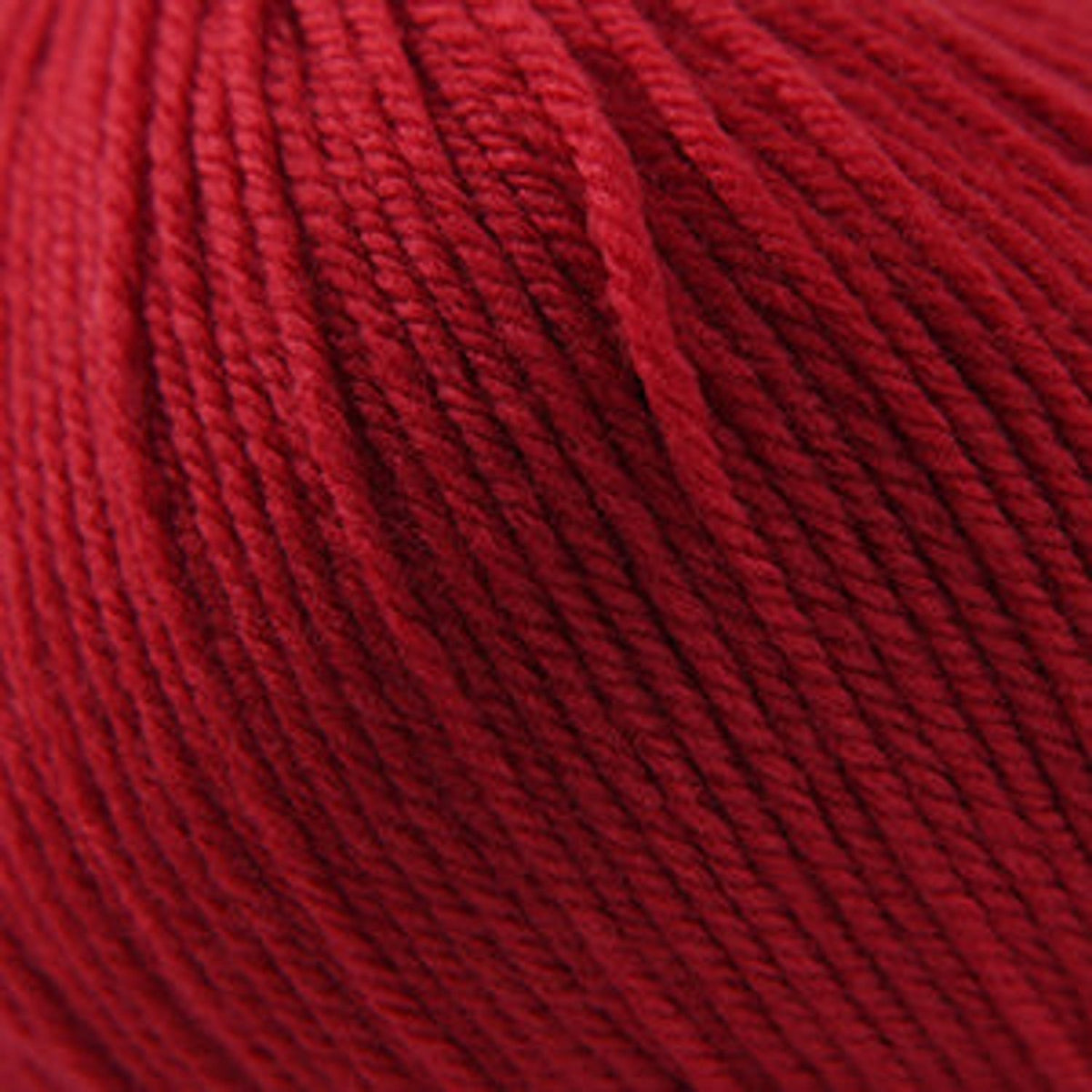 Cascade Yarns 220 Superwash wool in vibrant red, perfect for knitting and crochet projects