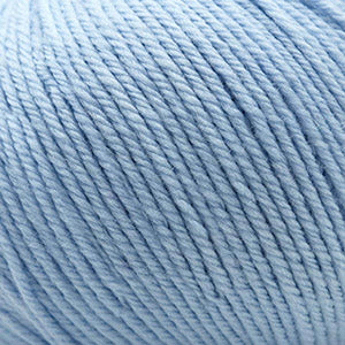 Soft blue skein of Cascade Yarns 220 Superwash wool, perfect for knitting and crochet projects