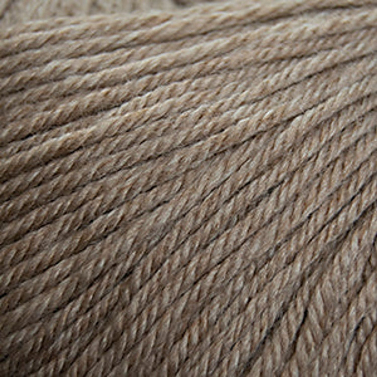 Cascade Yarns 220 Superwash wool in a soft beige color suitable for various knitting projects