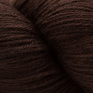 Close-up of Cascade Yarns Heritage superwash merino wool in rich brown color, perfect for soft knitting projects
