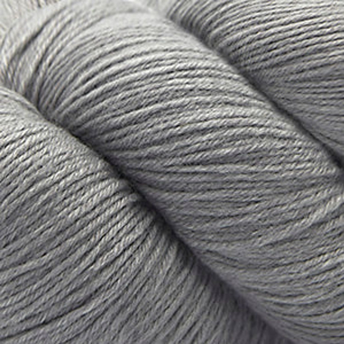 Cascade Yarns Heritage superwash merino wool in a soft gray shade for versatile knitting projects