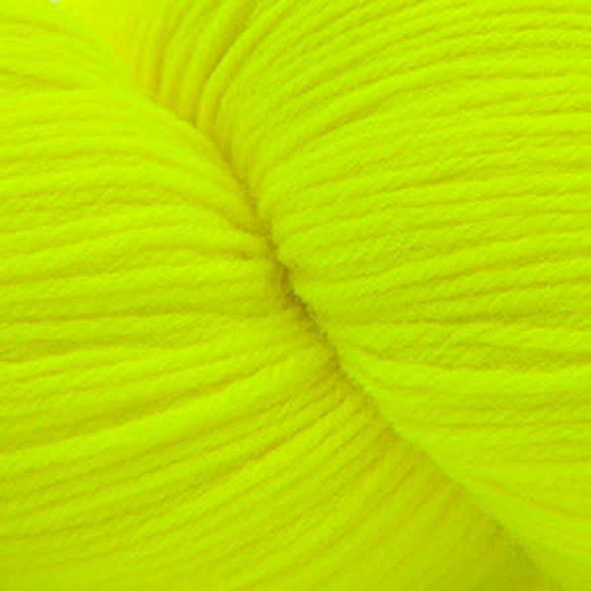 Cascade Yarns Heritage superwash merino wool in bright neon yellow, perfect for vibrant knitting projects.
