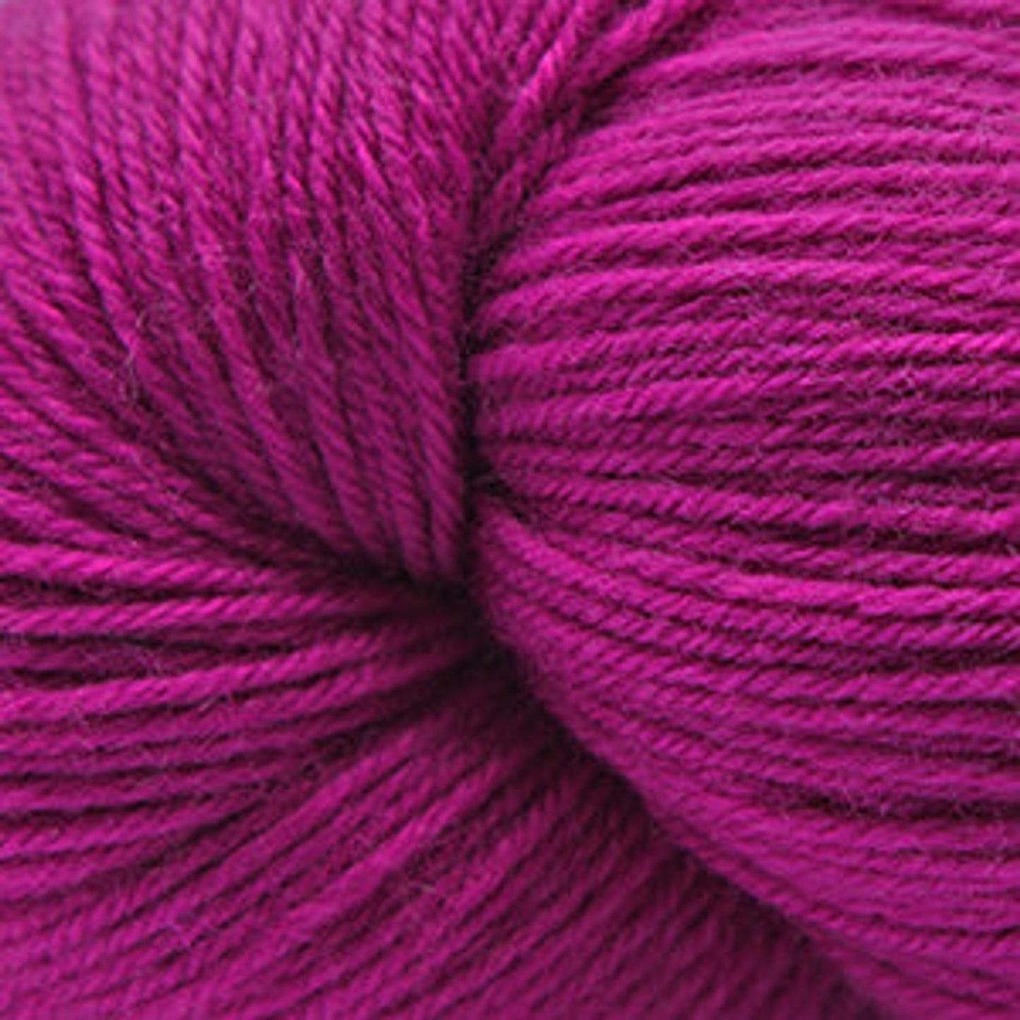 Cascade Yarns Heritage superwash merino wool in vibrant magenta for knitting and crocheting projects