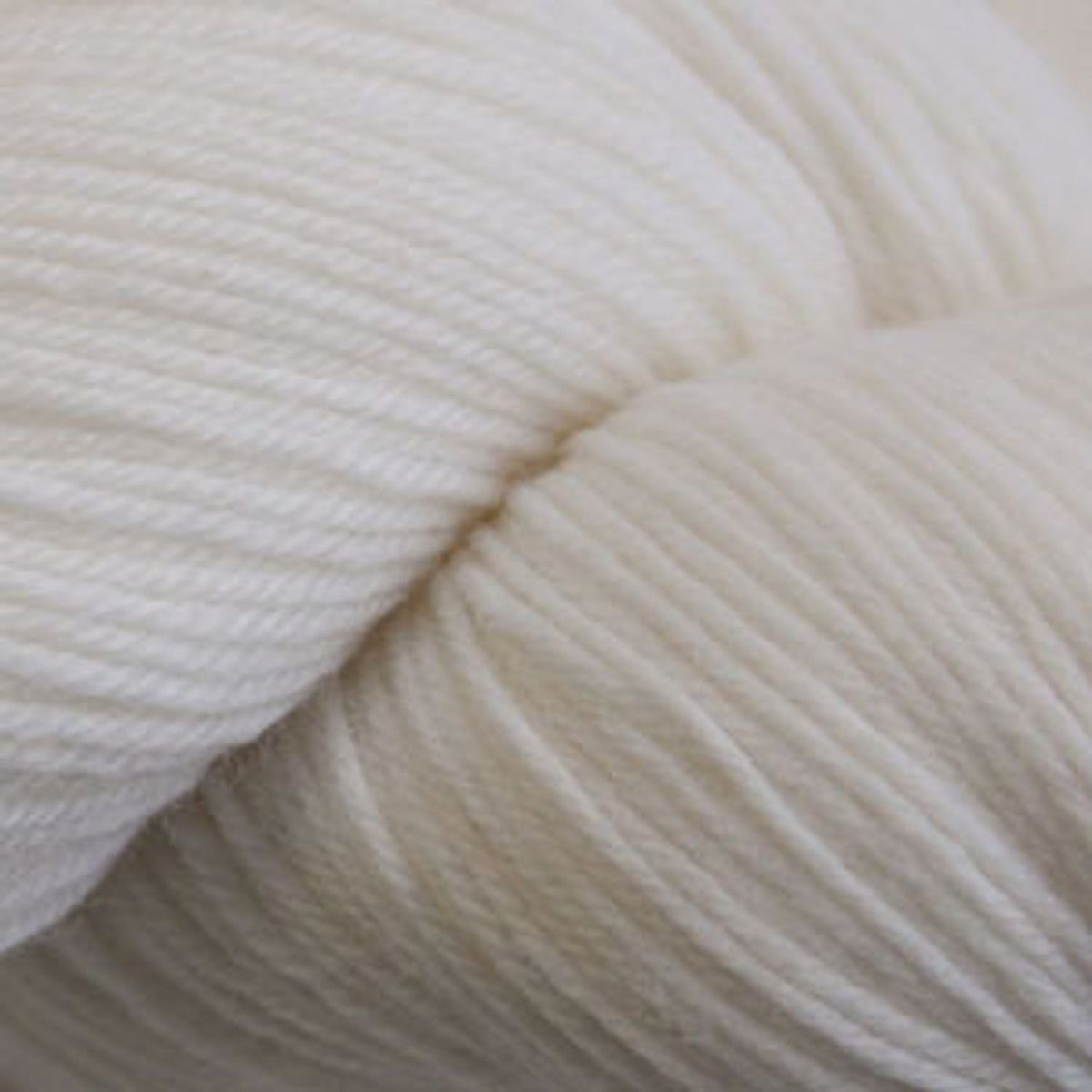 Cascade Yarns Heritage superwash merino wool in soft white for versatile knitting projects