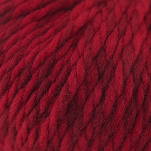 Cascade Yarns Lana Grande wool in deep red color with a soft, chunky texture for knitting projects