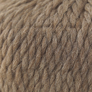Close-up of Cascade Yarns Lana Grande wool in a warm brown shade, perfect for cozy knitting projects.