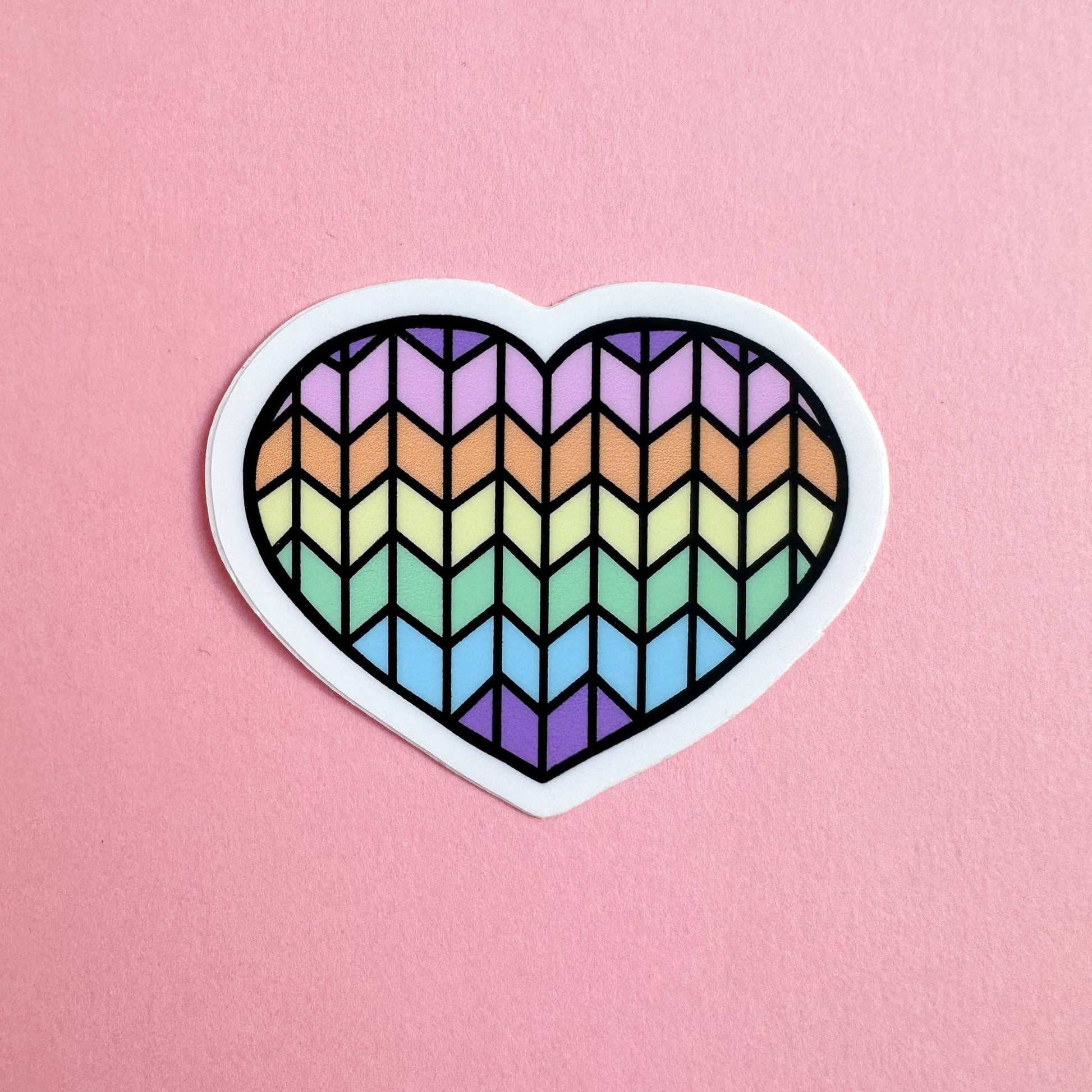 Colorful heart-shaped cat sticker with a geometric rainbow pattern for cat lovers