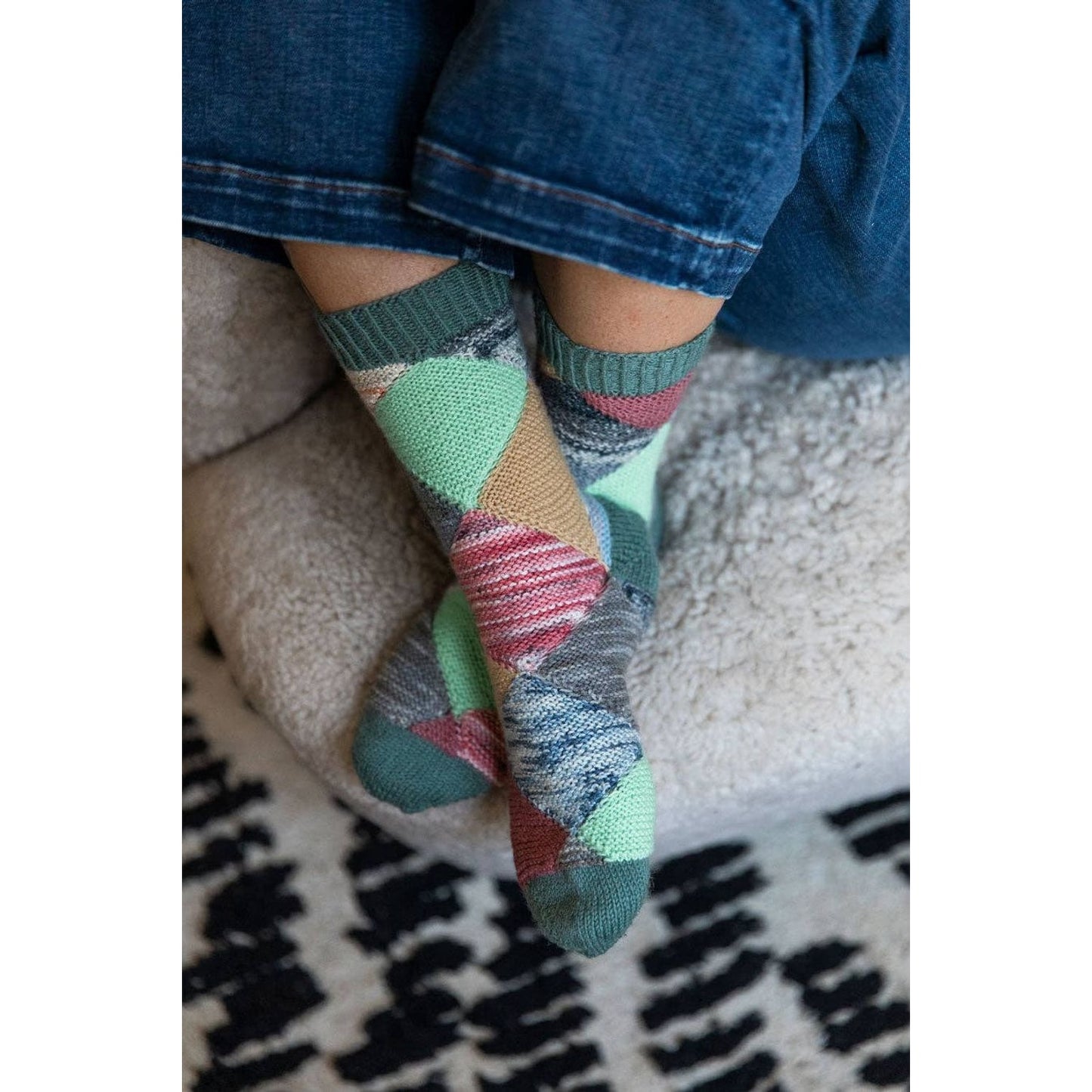Colorful hand-knit socks showcasing patterns ideal for chunky yarn crochet projects