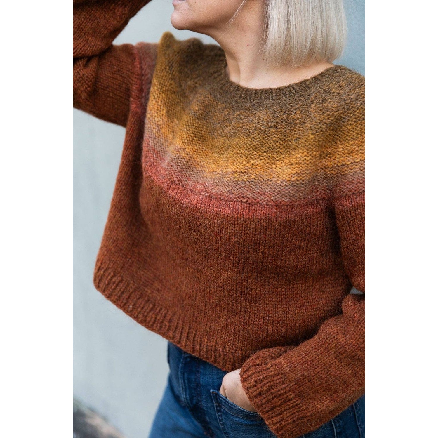 Cozy cropped sweater designed for chunky yarn crochet projects in warm autumn colors
