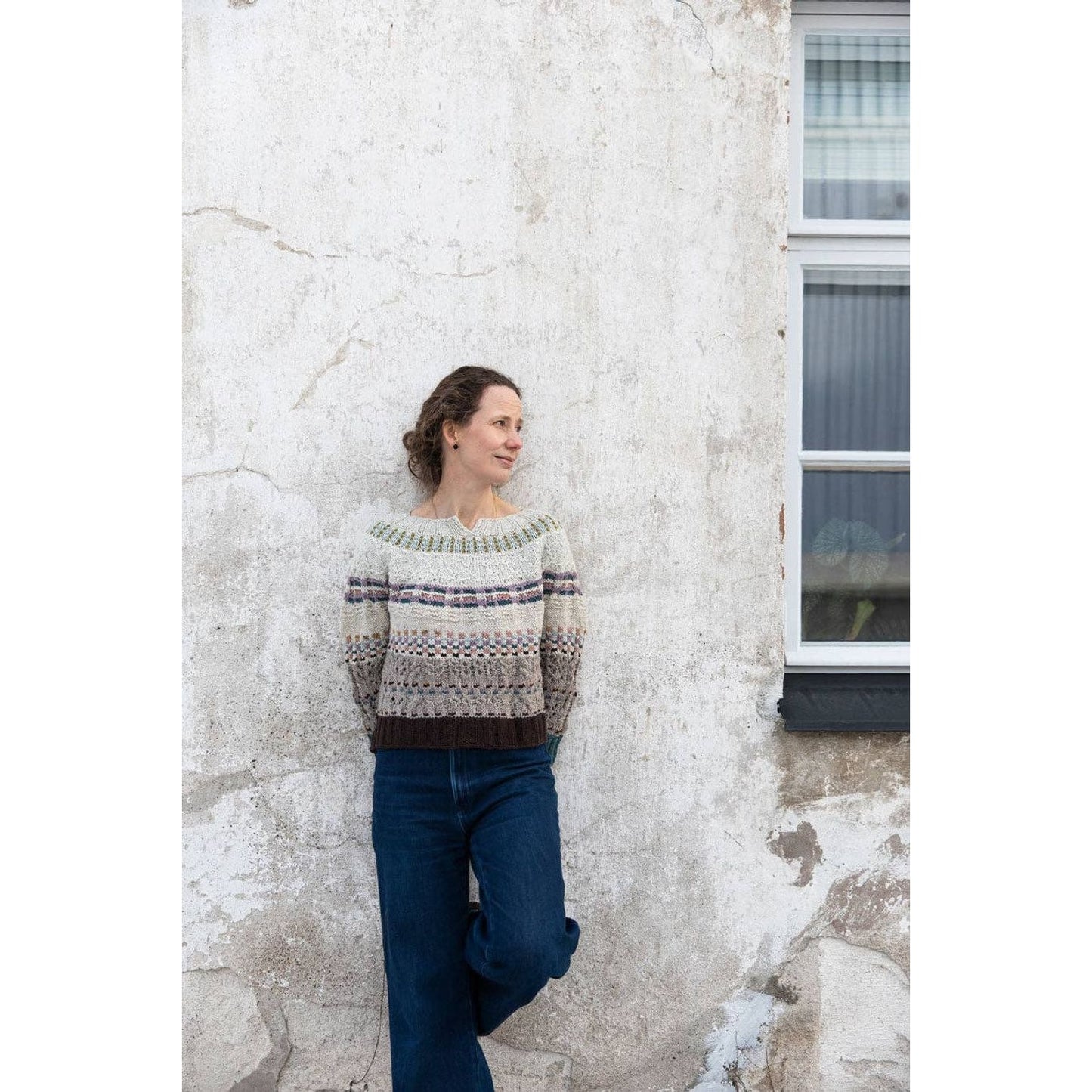 Stylish woman wearing a knitted sweater, perfect for chunky yarn crochet projects