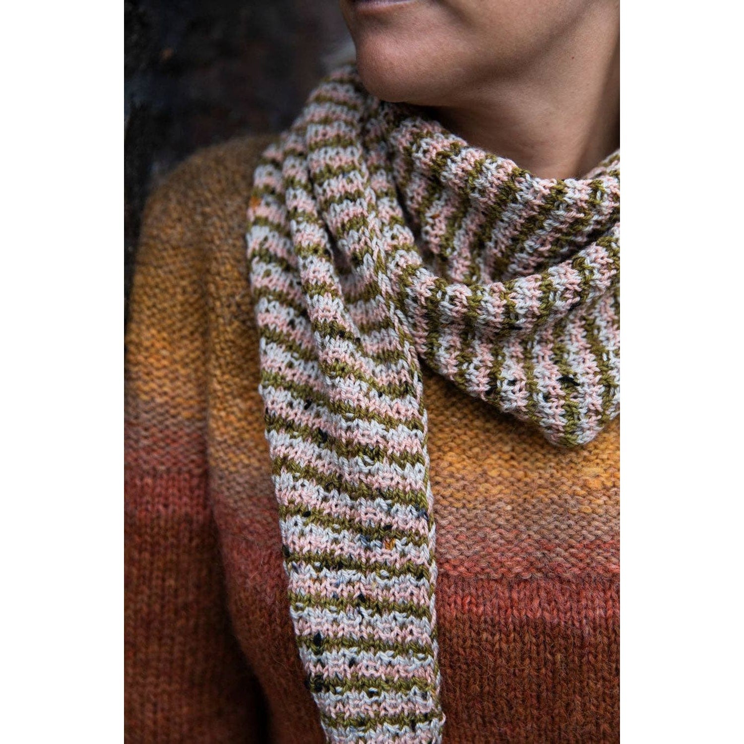 Hand-knit scarf featuring colorful stripes, perfect for chunky yarn crochet projects