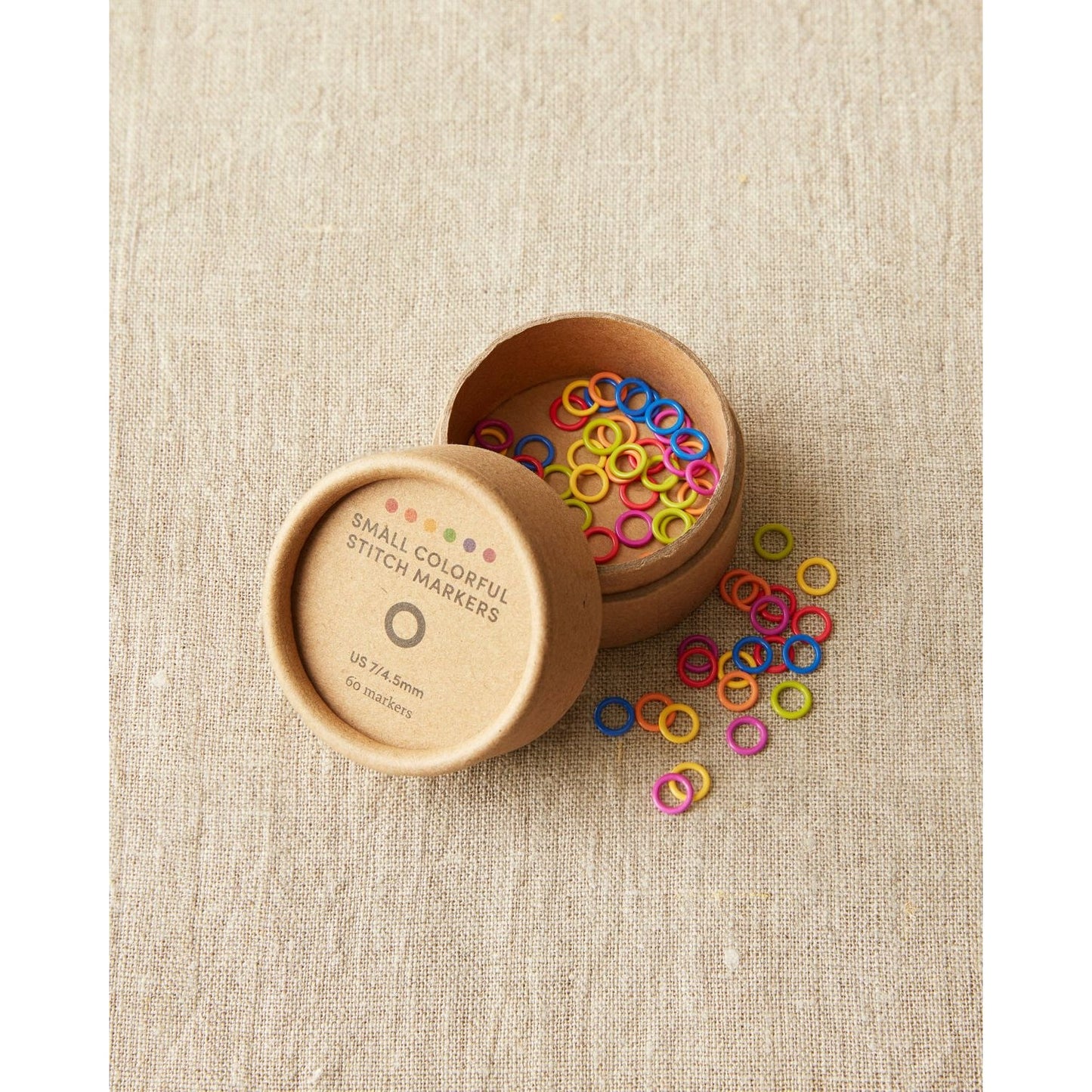 Cocoknits ring stitch markers in a container with colorful small markers for easy knitting