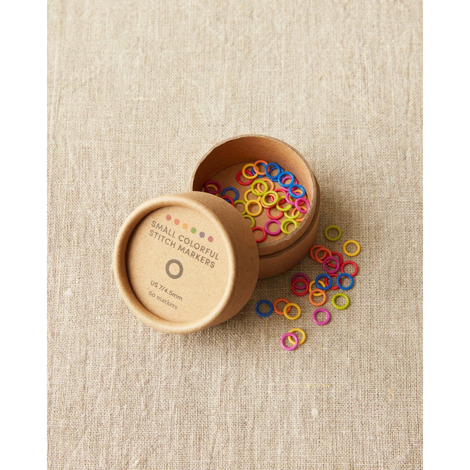 Cocoknits ring stitch markers in a container with colorful small markers for easy knitting