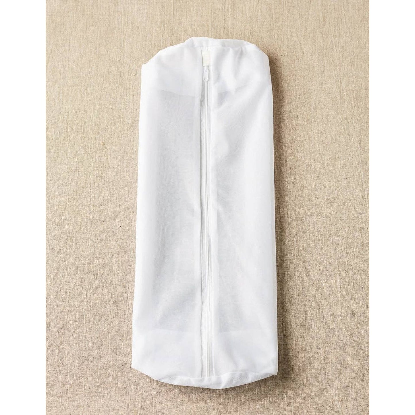 Cocoknits sweater care bag set in white, designed to protect and care for your knitted garments
