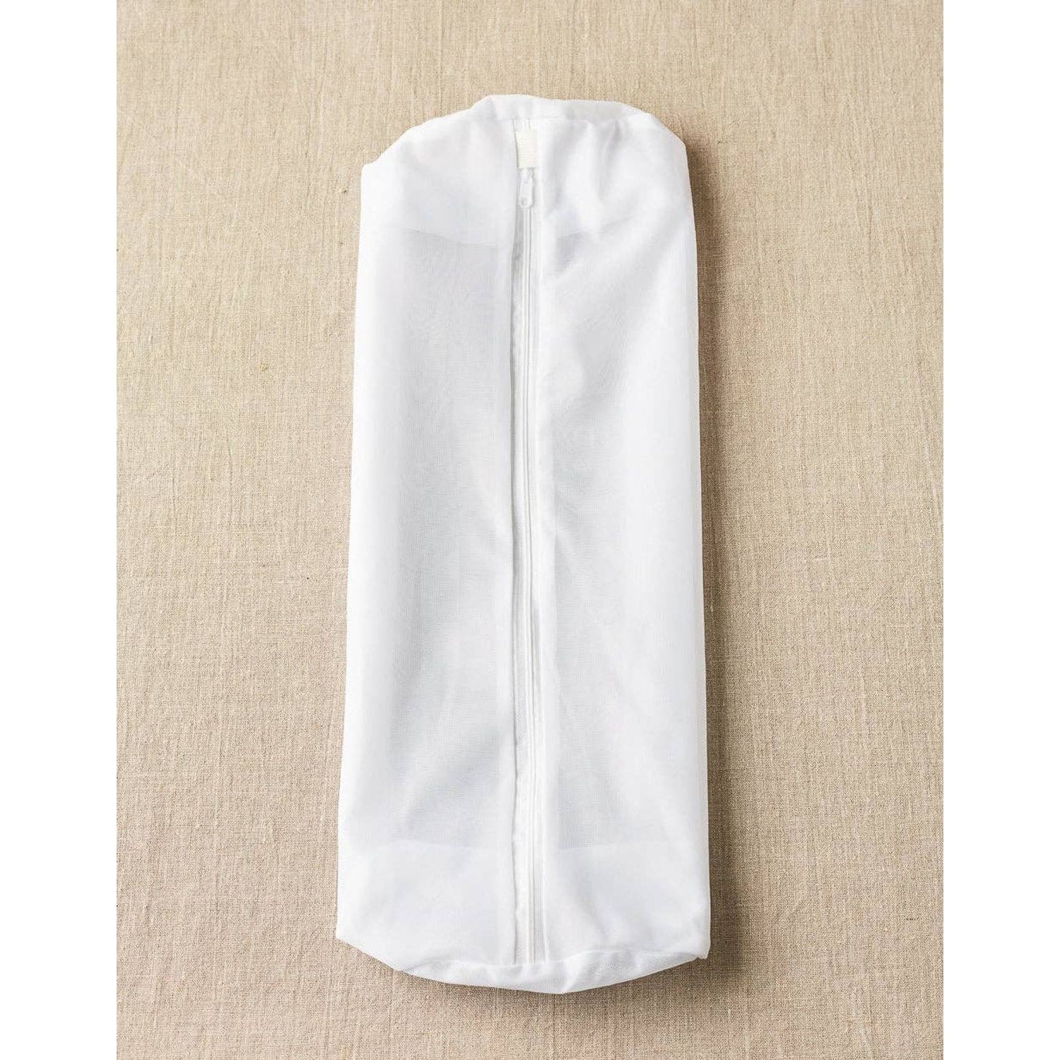 Cocoknits sweater care bag set in white, designed to protect and care for your knitted garments