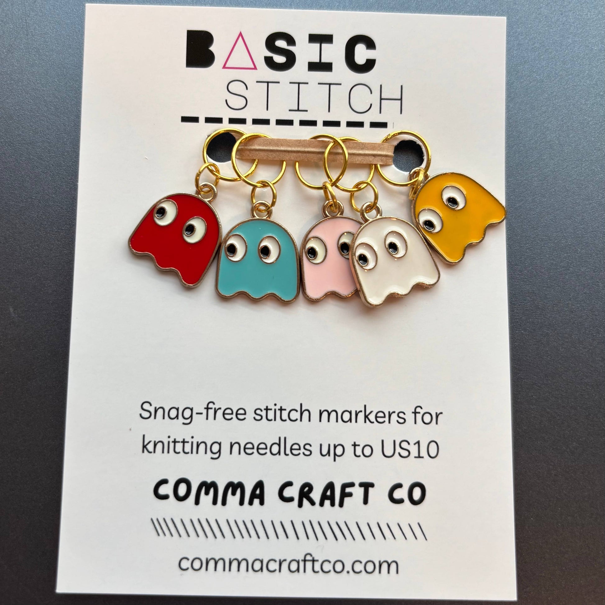 Colorful retro-inspired stitch markers featuring ghost designs for knitting at gaming retro stores