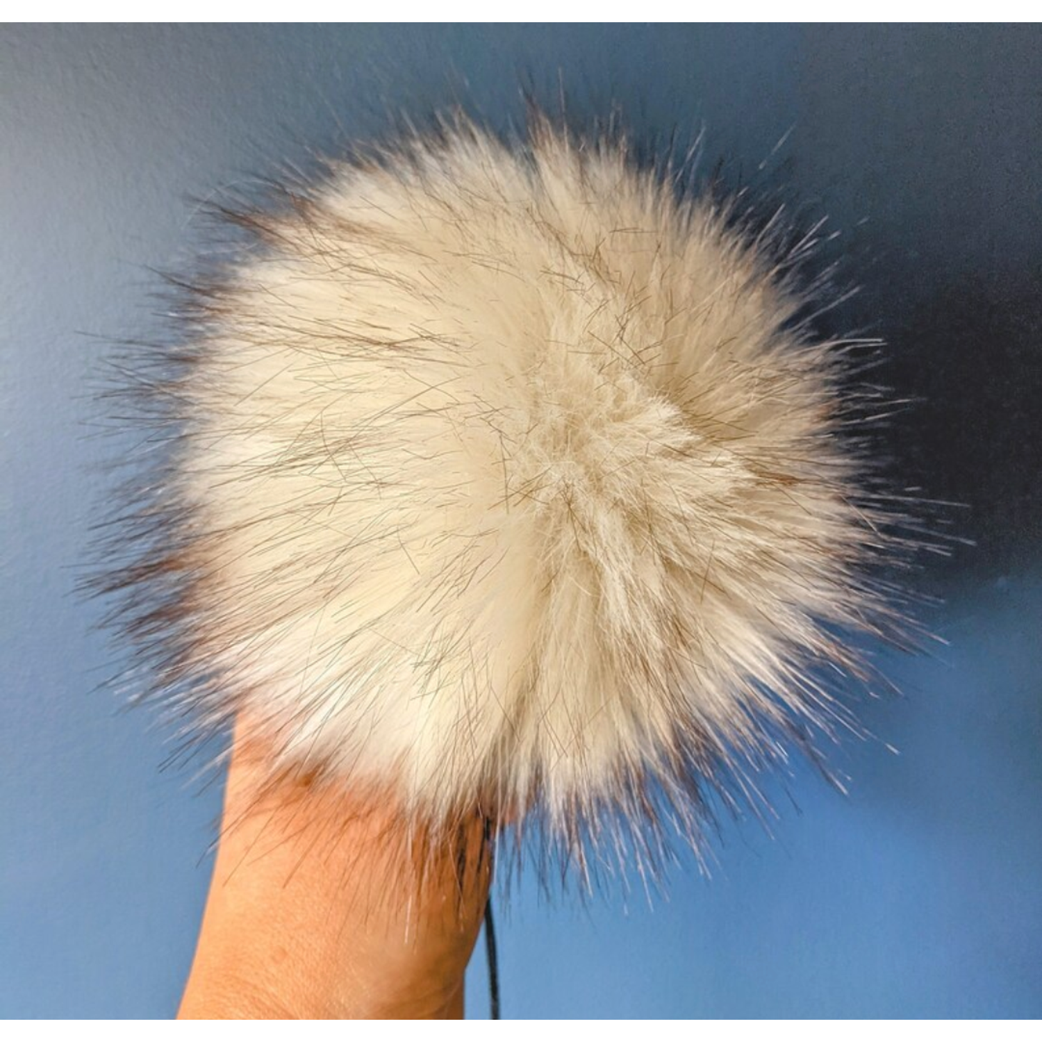 Fluffy White countrystixco pom pom accessory for adding a stylish touch to bags and clothing