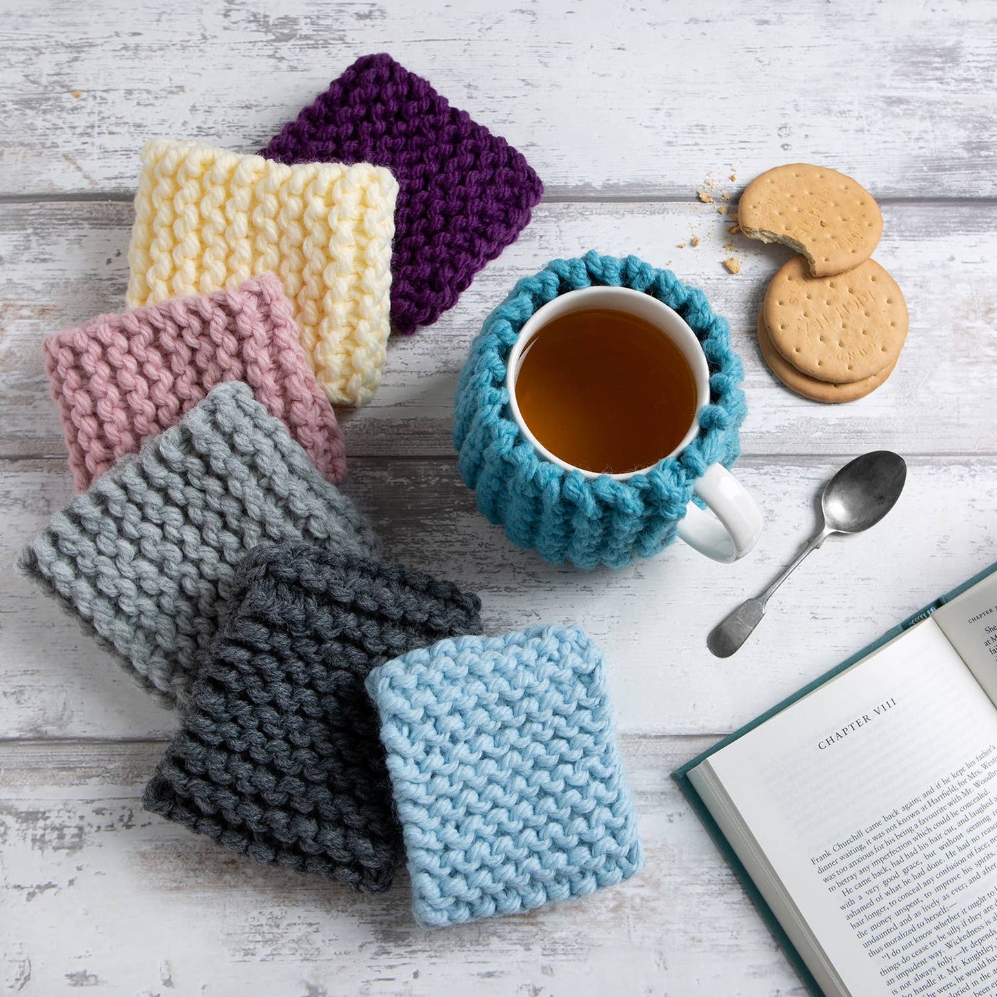Wool Couture Company set of colorful knitted cup cozies with tea mug cookies and book beginner knitting kit for cup cozy