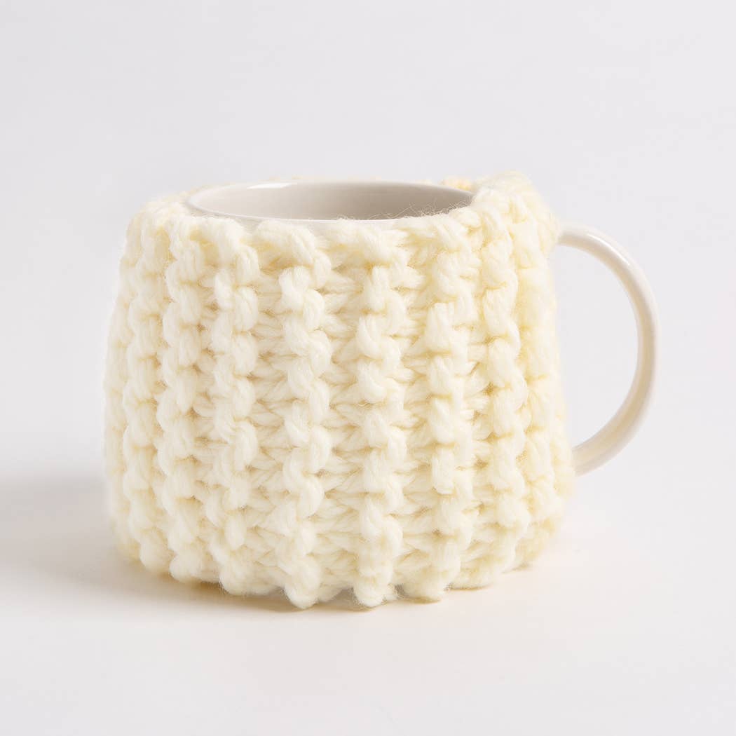 Wool Couture Company cream chunky knit mug with ribbed texture showing beginner knitting kit for cup cozy