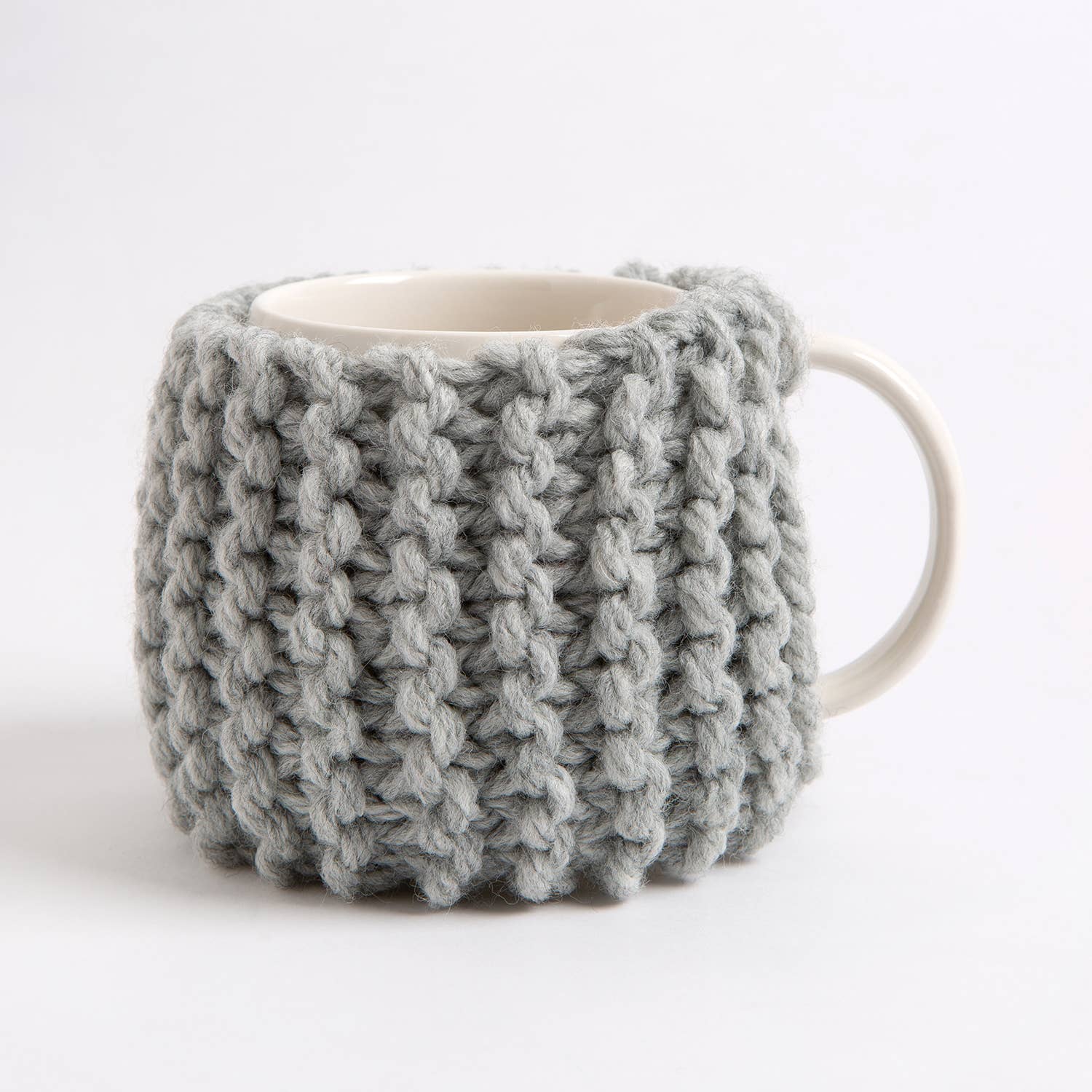 beginner knitting kit for cup cozy Wool Couture Company gray chunky ribbed mug cozy on white ceramic mug