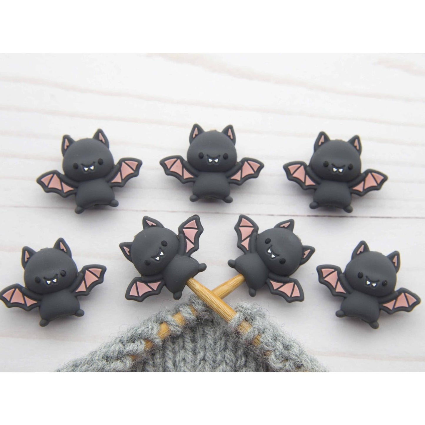 Fox and Pine Stitches bat stitch stoppers knitting set of seven black cartoon bat needle stoppers on gray yarn