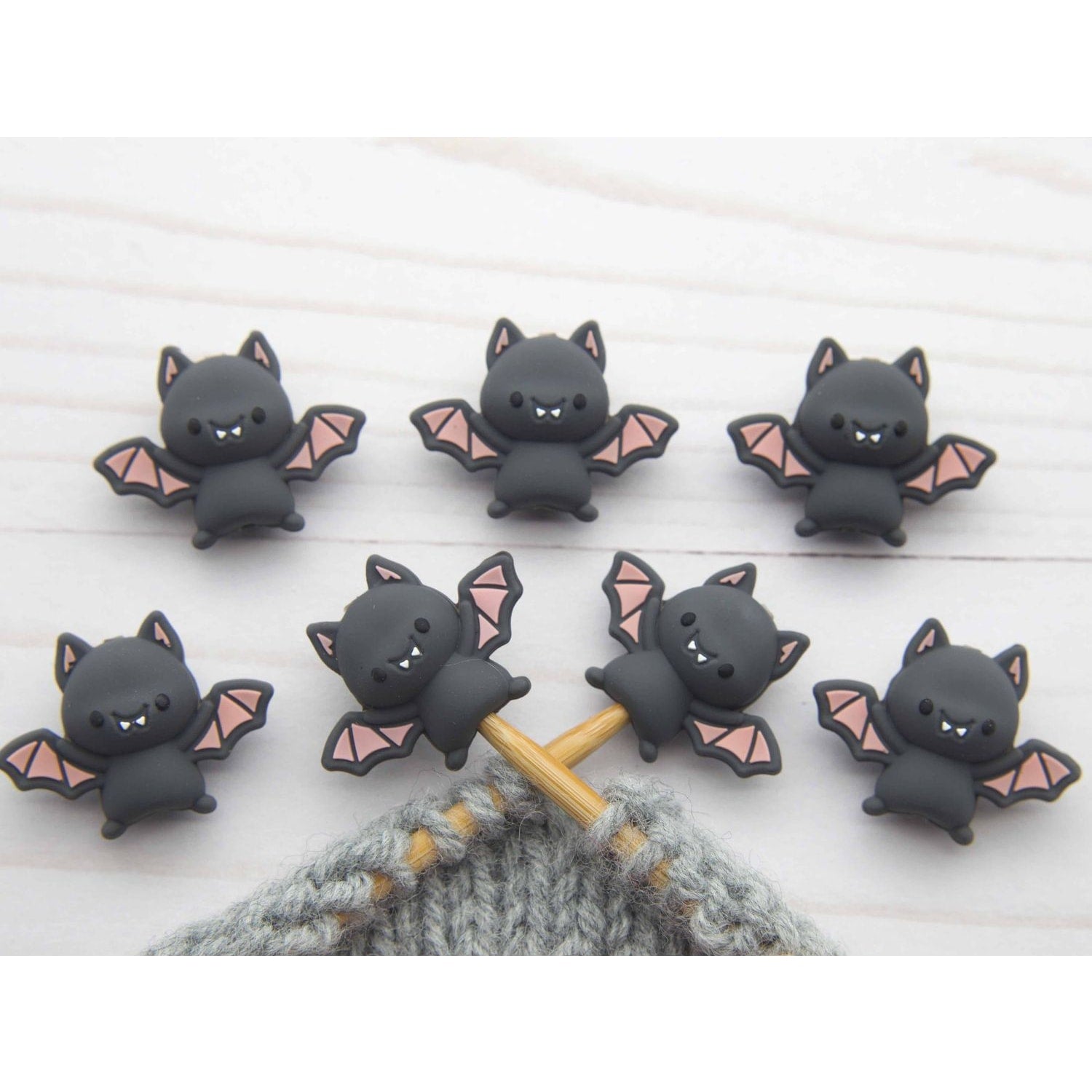 Fox and Pine Stitches bat stitch stoppers knitting set of seven black cartoon bat needle stoppers on gray yarn