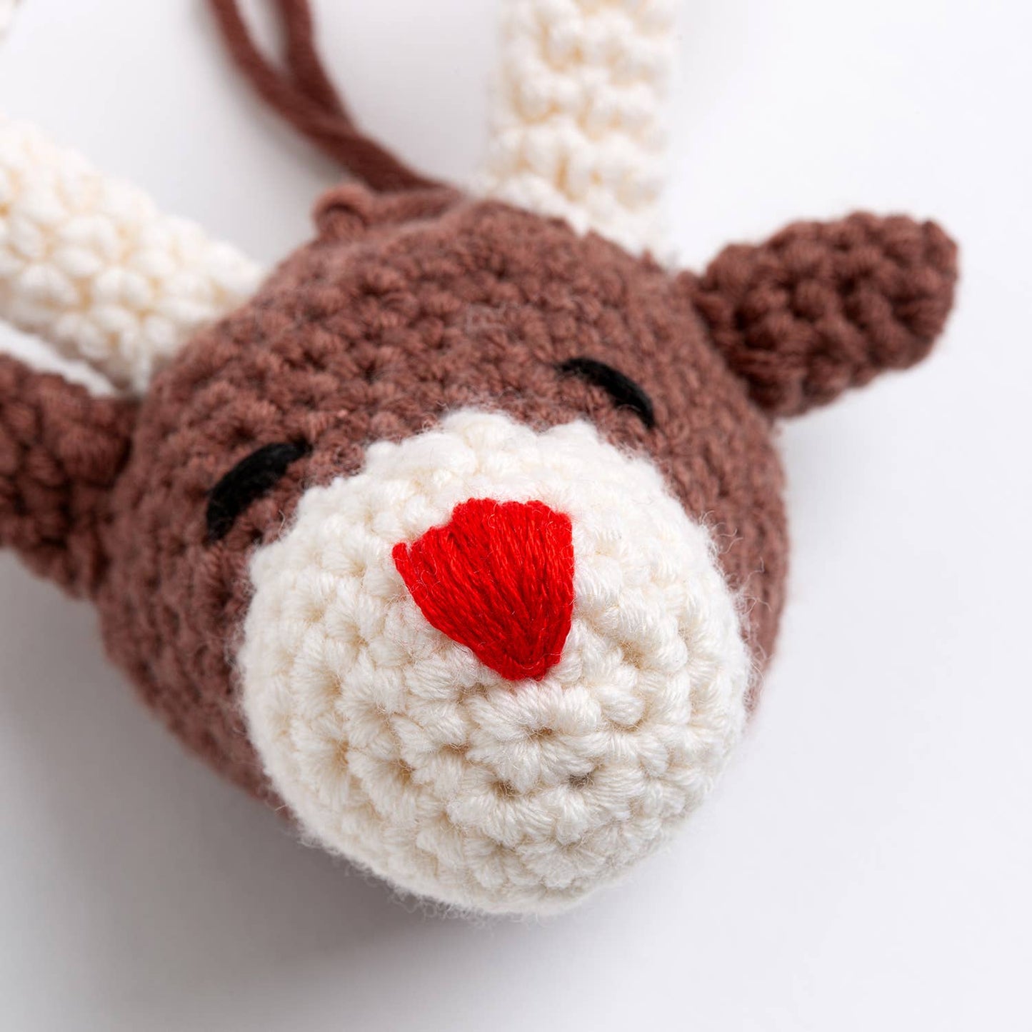 Belle the Reindeer crochet pattern brown and cream amigurumi reindeer head with red nose and loop