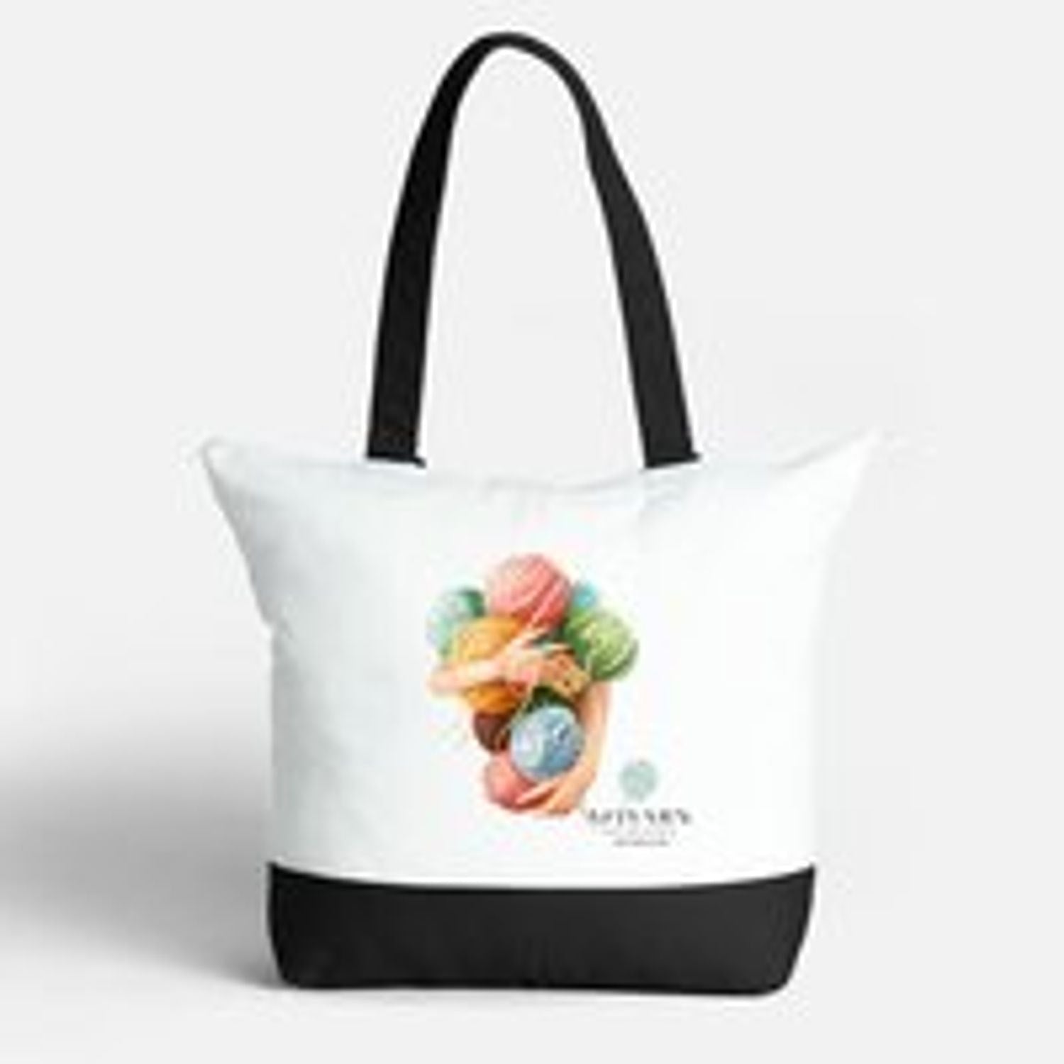 AriYARN Shop and Studio cotton tote bag for crochet supplies, white canvas tote with black base, colorful yarn print