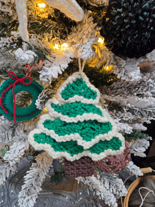 Crochet Christmas tree ornament workshop project featuring a green tree design with a brown pot