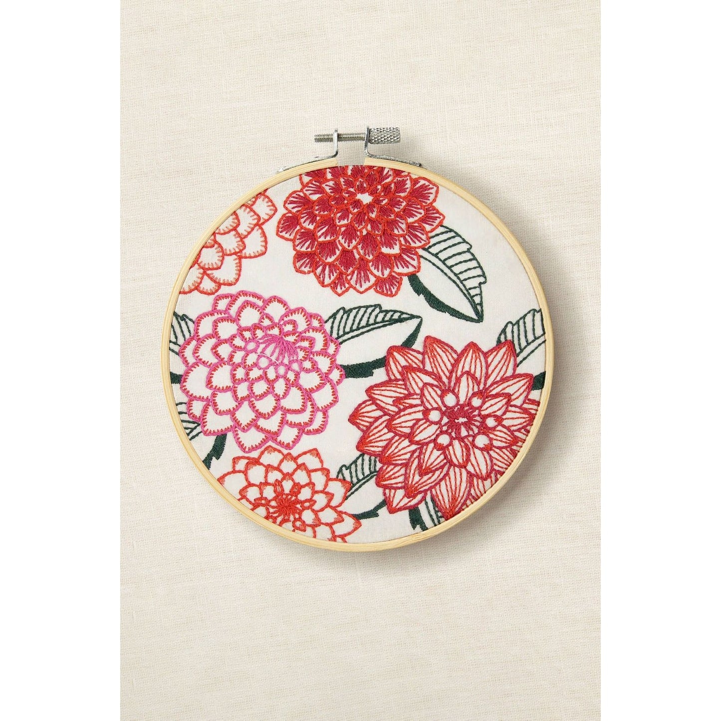 DMC Embroidery Hoop Art featuring colorful dahlias in vibrant red and pink hues