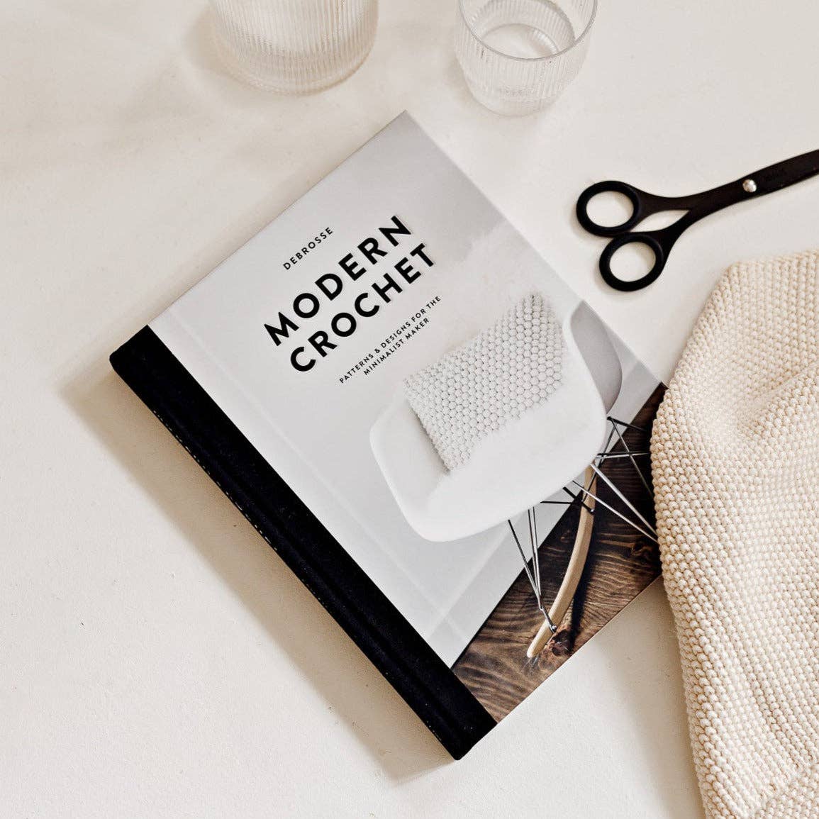 Modern Crochet Patterns Book by Paige Tate & Co. with stylish designs showcased on the cover