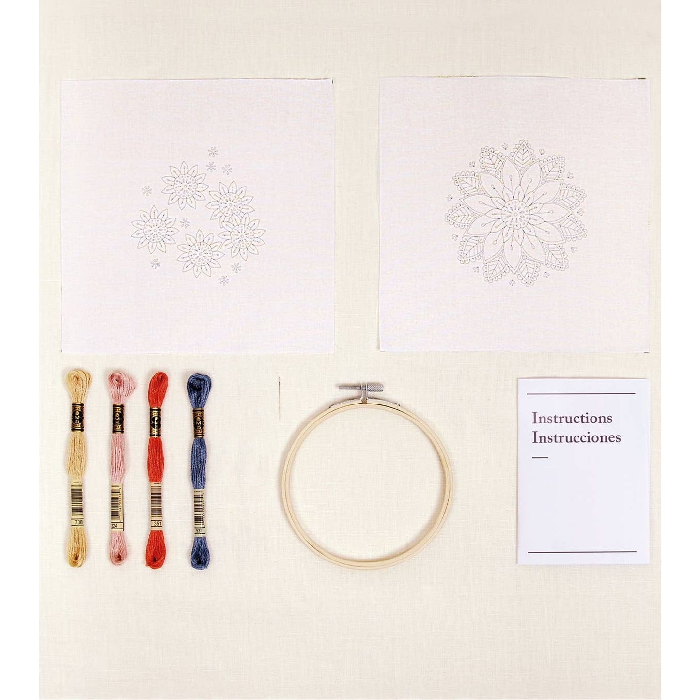 DMC kit embroidery with threads, fabric squares, hoop, and instructions for creative projects