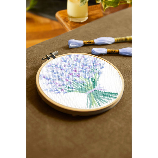 DMC cross-stitch kit featuring a lavender bouquet design with vibrant colors and included threads