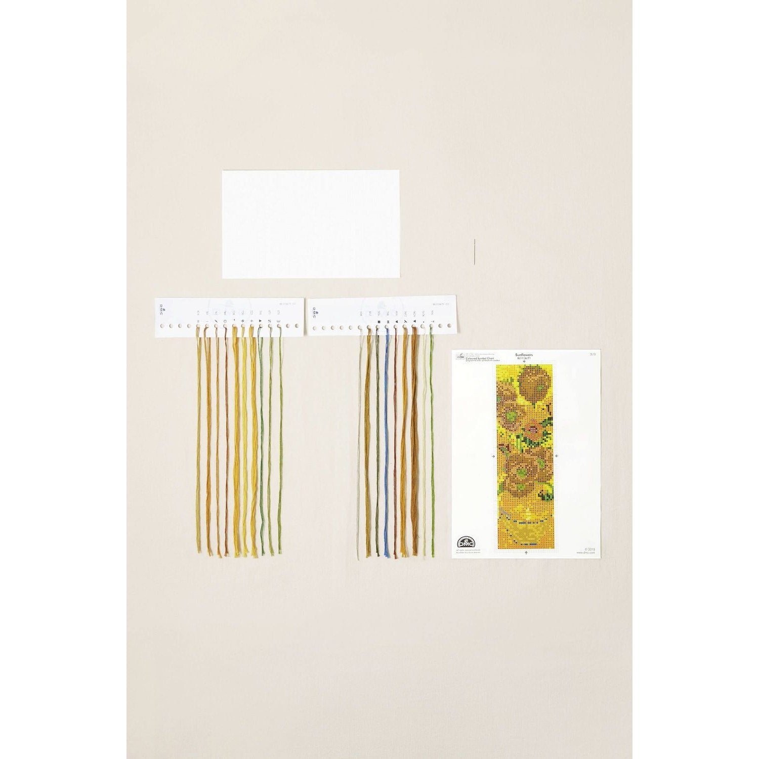 DMC embroidery floss in vibrant shades for sunflowers, including a color chart and design template