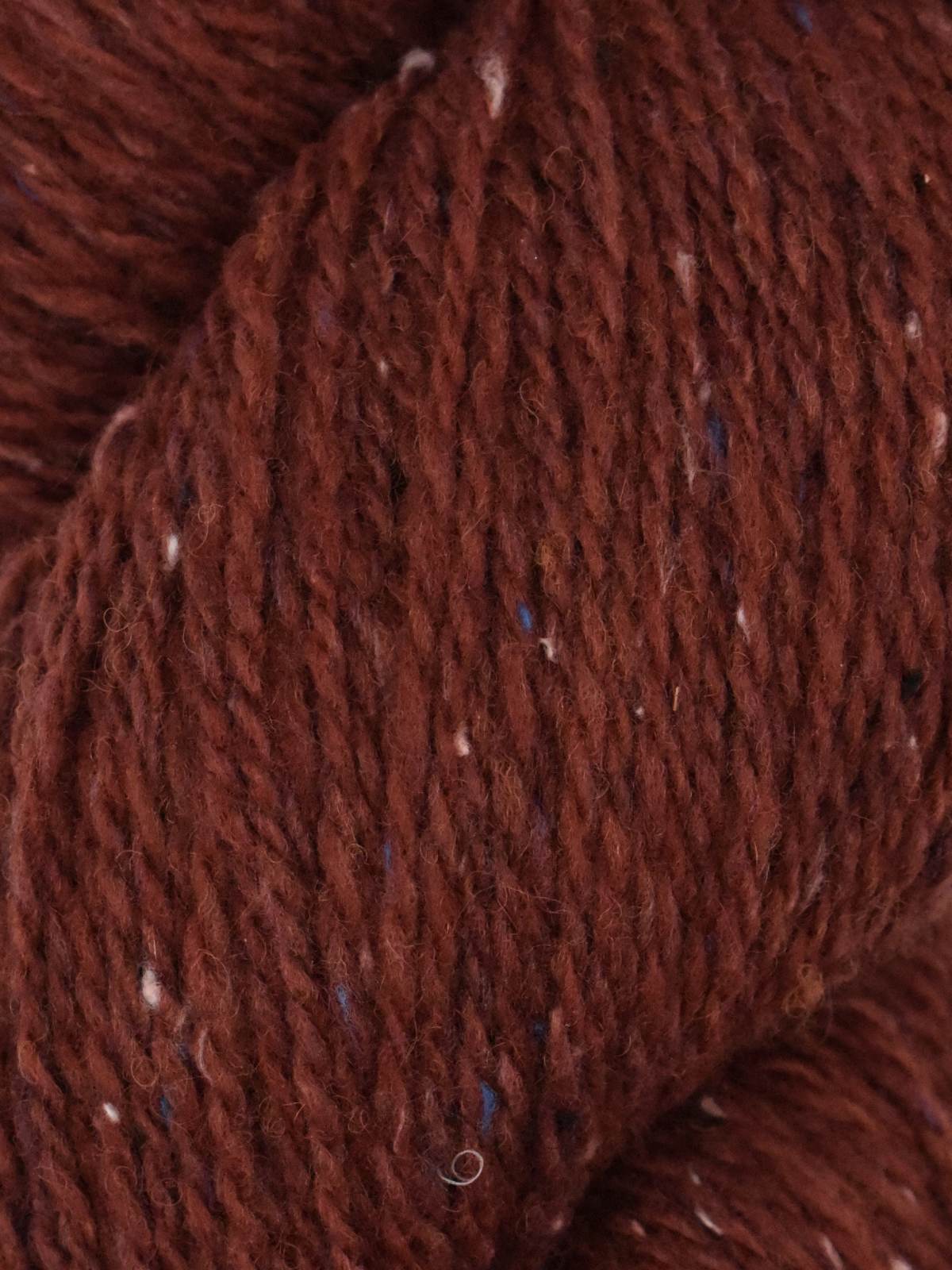 Rich brown Ella Rae Eco Tweed yarn with subtle flecks perfect for cozy knitting projects