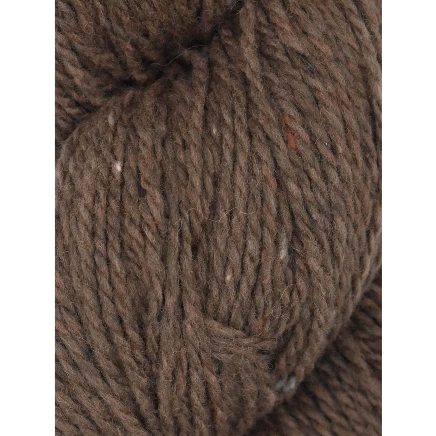 Close-up of Ella Rae Eco Tweed yarn in rich brown hues with a textured finish