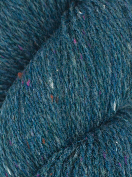 Ella Rae Eco Tweed yarn in a rich blue shade with colorful flecks for vibrant knitting projects