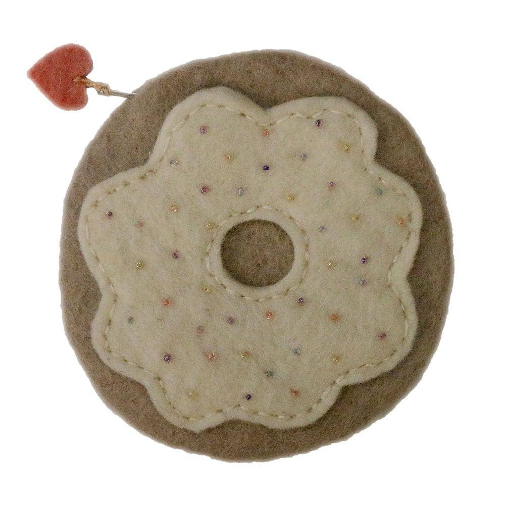 Cute donut-shaped felt bag with decorative stitching and heart charm for stylish storage