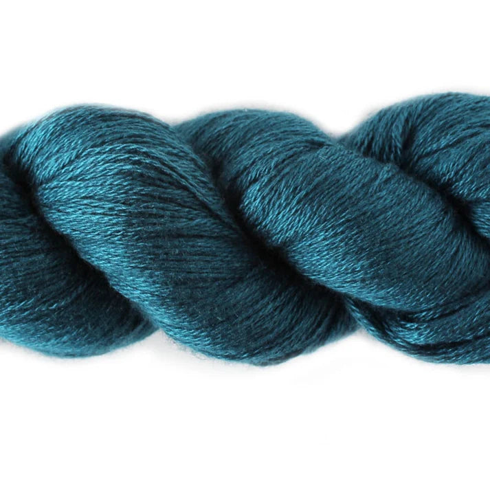 Lotus Yarns Fingering yarn weight in a rich teal hue, perfect for lightweight projects