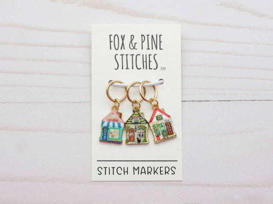 Fox and Pine Stitches set of three house shaped stitch markers for crochet with colorful enamel house charms on gold rings