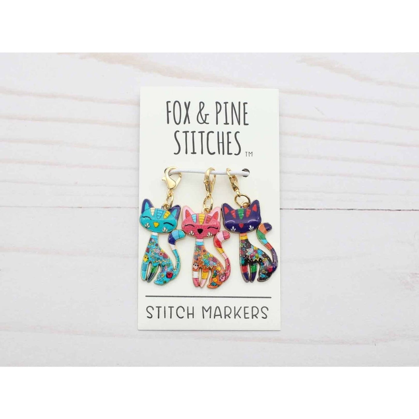 Colorful cat-shaped knitting progress keepers from Fox & Pine Stitches for creative knitters