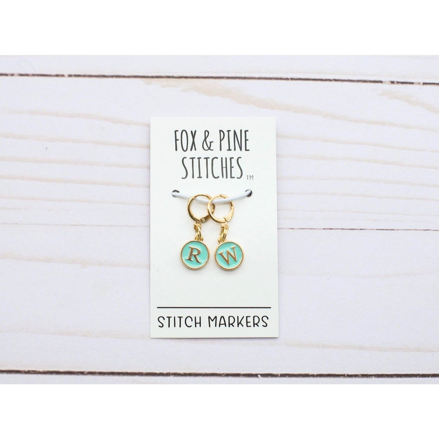 Fox & Pine Stitches Stitch Markers for Crocheting with initials RW on a display card