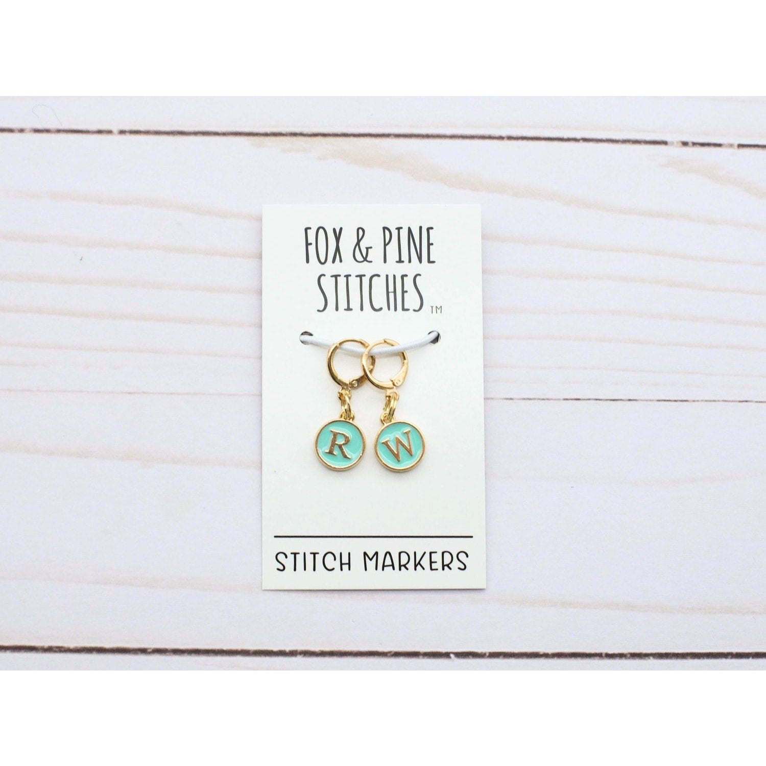Fox & Pine Stitches Stitch Markers for Crocheting with initials RW on a display card