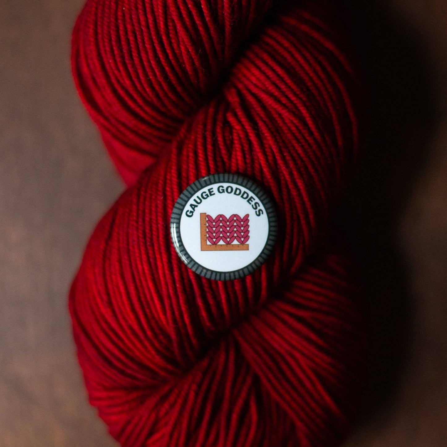 Camp Stitchwood Red Yarn with Gauge Goddess Logo for Merit Badge Required for Eagle Projects