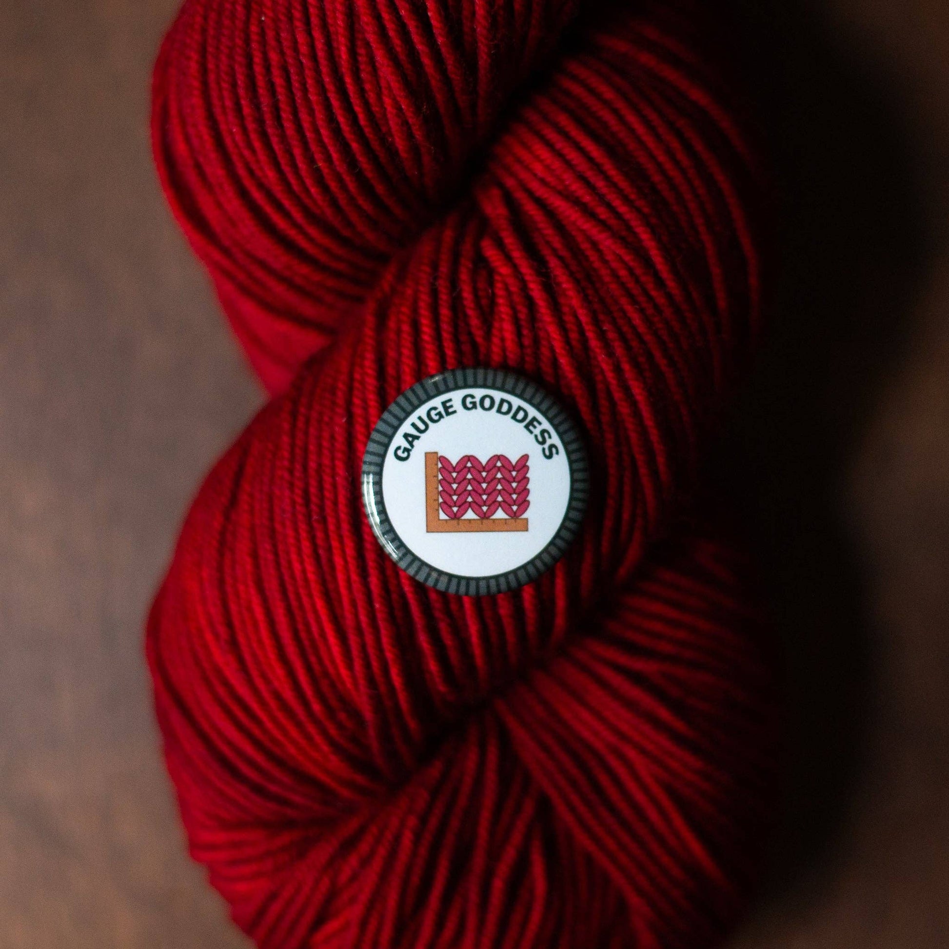 Camp Stitchwood Red Yarn with Gauge Goddess Logo for Merit Badge Required for Eagle Projects