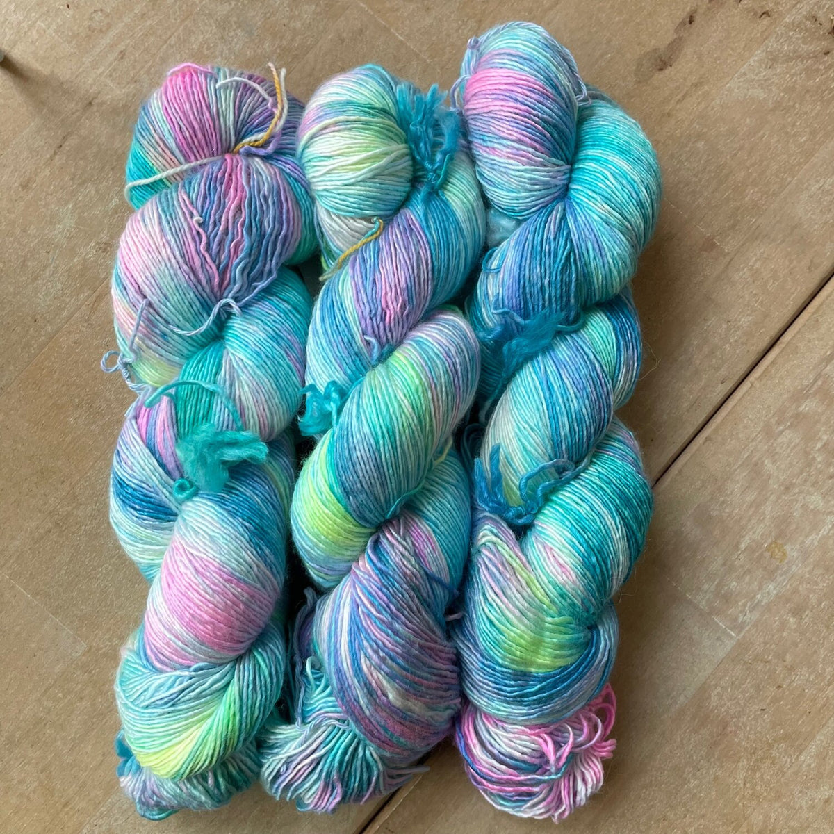 Gnome Depot Fiber DK weight yarn in pastel pink and blue shades, perfect for knitting and crafting
